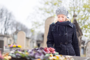 Woman in black visiting grave: Lorenzo & Lorenzo Wrongful Death Blog