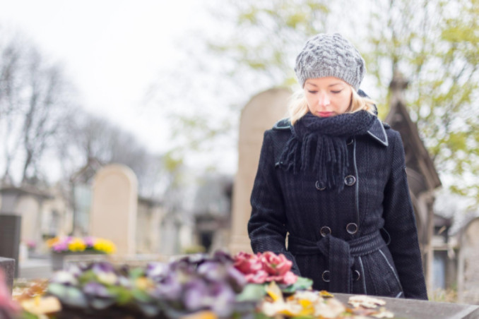 Woman in black visiting grave: Lorenzo & Lorenzo Wrongful Death Blog