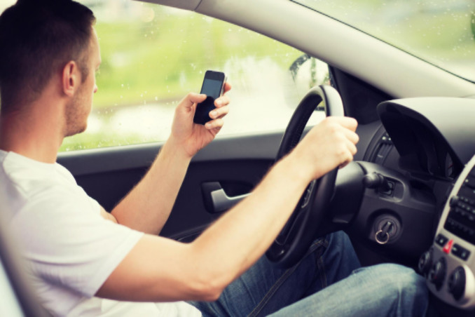 Man texting while driving: Lorenzo & Lorenzo Auto & Vehicle Accidents Article